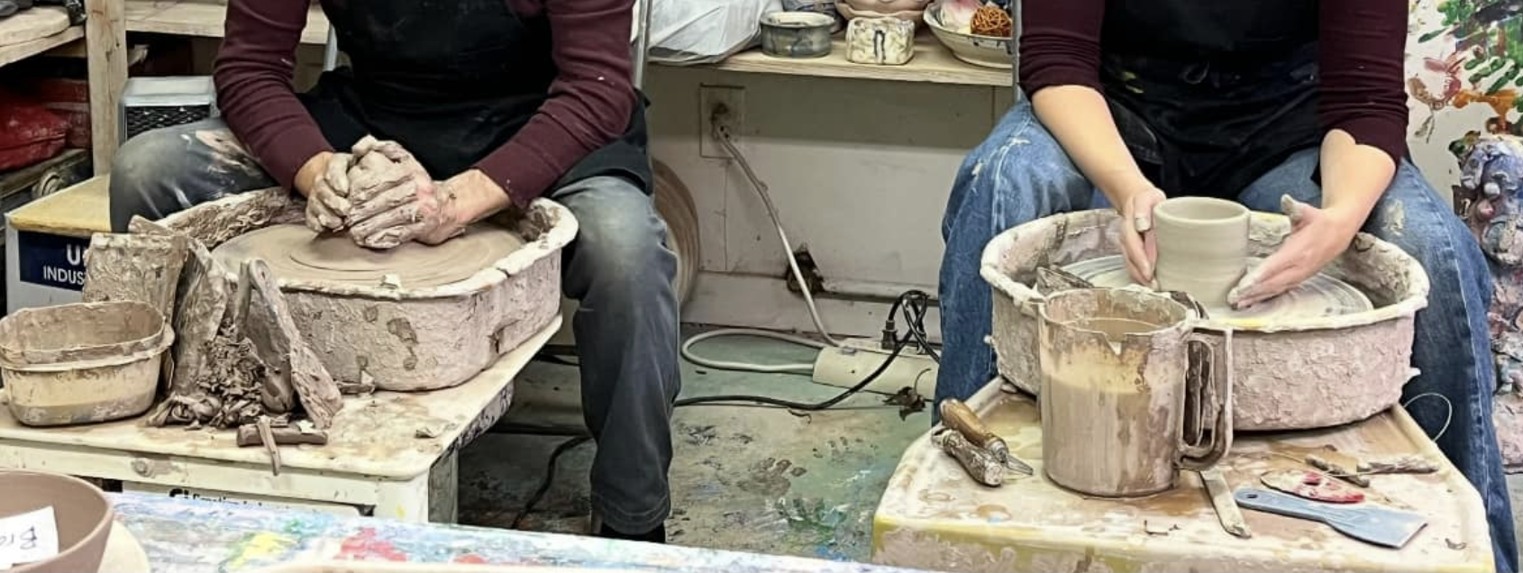 people throwing clay